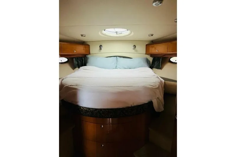  Yacht Photos Pics Luxurious cabin interior of 2005 Regal Commodore 4260 yacht with cozy bed.