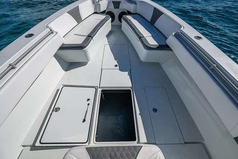  Yacht Photos Pics 2022 Contender 39 ST boat interior with seating and storage compartments on open water.