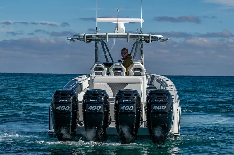  Yacht Photos Pics 2022 Contender 39 ST boat with four powerful engines cruising on open water.