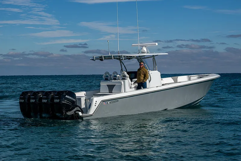  Yacht Photos Pics 2022 Contender 39 ST boat on water with multiple outboard engines.