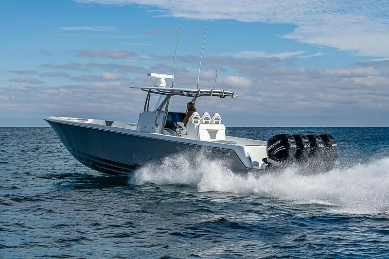  Yacht Photos Pics 2022 Contender 39 ST boat cruising on open water, showcasing powerful engines.
