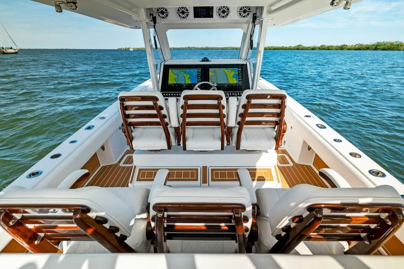  Yacht Photos Pics 2022 Barker Boatworks 40 HPC cockpit with luxurious seating and advanced navigation system.