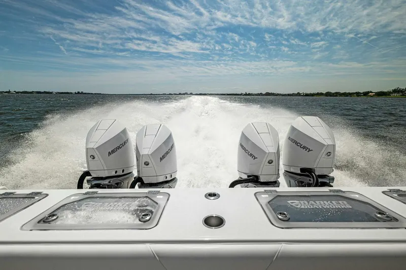  Yacht Photos Pics 2022 Barker Boatworks 40 HPC with four Mercury engines speeding on open water.
