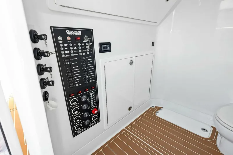  Yacht Photos Pics 2022 Barker Boatworks 40 HPC interior with control panel and modern flooring.