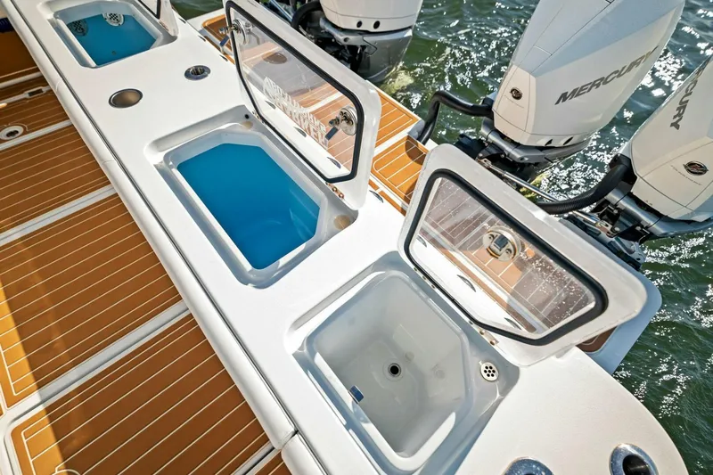  Yacht Photos Pics 2022 Barker Boatworks 40 HPC with open storage compartments and Mercury outboard engines.