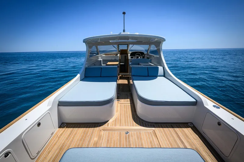 39 Outboard Yacht Photos Pics Luxurious Toy 39 outboard boat, 2025 model, with spacious deck and seating on open sea.