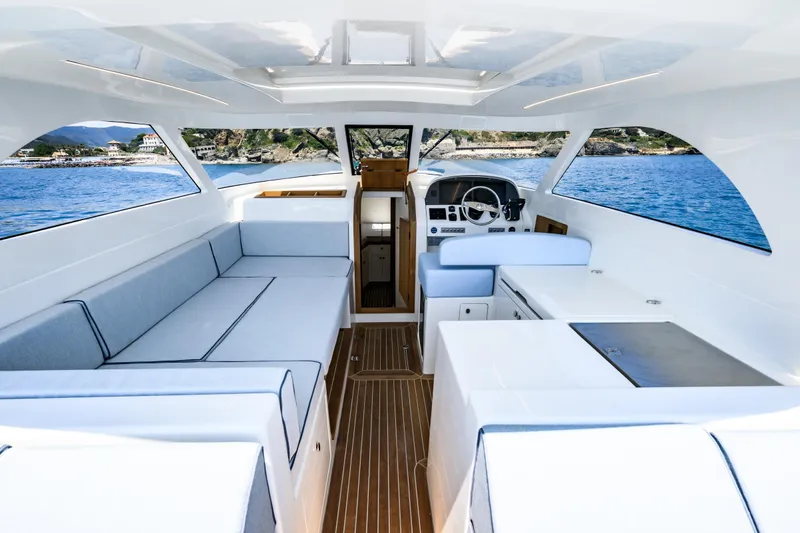 39 Outboard Yacht Photos Pics Luxurious interior of 2025 Toy 39 outboard boat with sleek design and spacious seating.