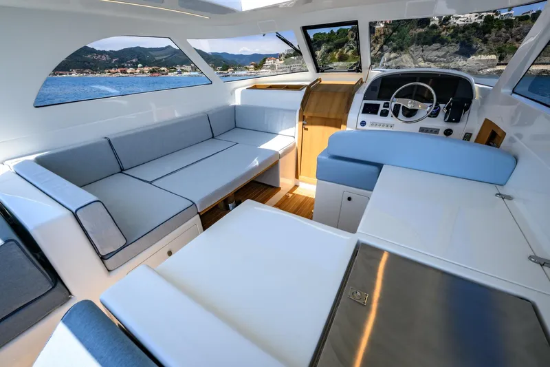 39 Outboard Yacht Photos Pics Luxurious interior of 2025 Toy 39 outboard boat with spacious seating and modern design.