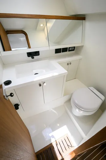 39 Outboard Yacht Photos Pics Modern bathroom in 2025 Toy 39 outboard boat with sleek design and white fixtures.