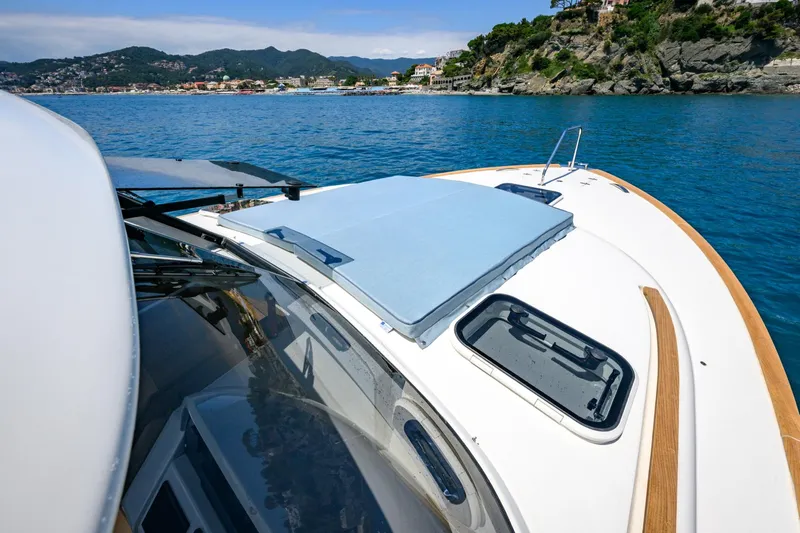 39 Outboard Yacht Photos Pics Modern Toy 39 outboard boat cruising on scenic coastal waters, 2025 model.