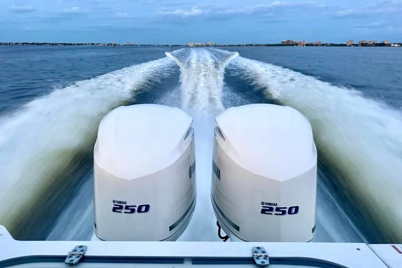  Yacht Photos Pics 2014 Pursuit S 280 Sport boat with dual Yamaha 250 engines on open water.