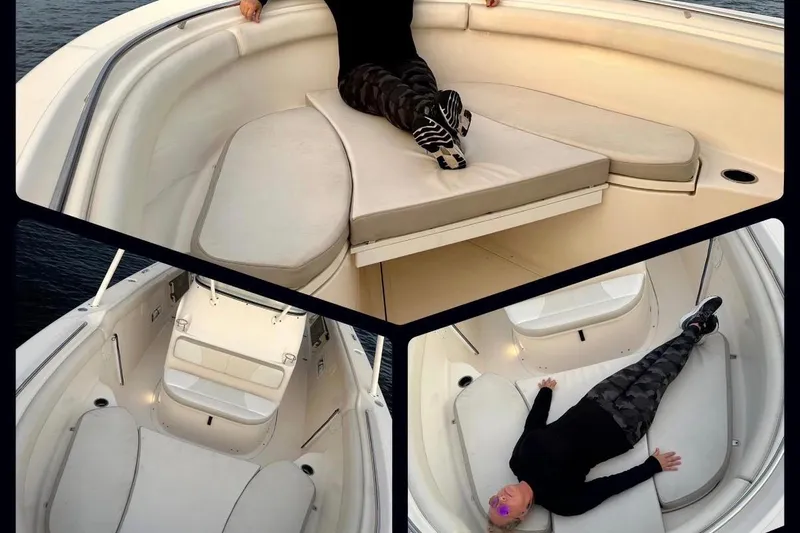  Yacht Photos Pics 2014 Pursuit S 280 Sport boat interior with cushioned seating and person relaxing.