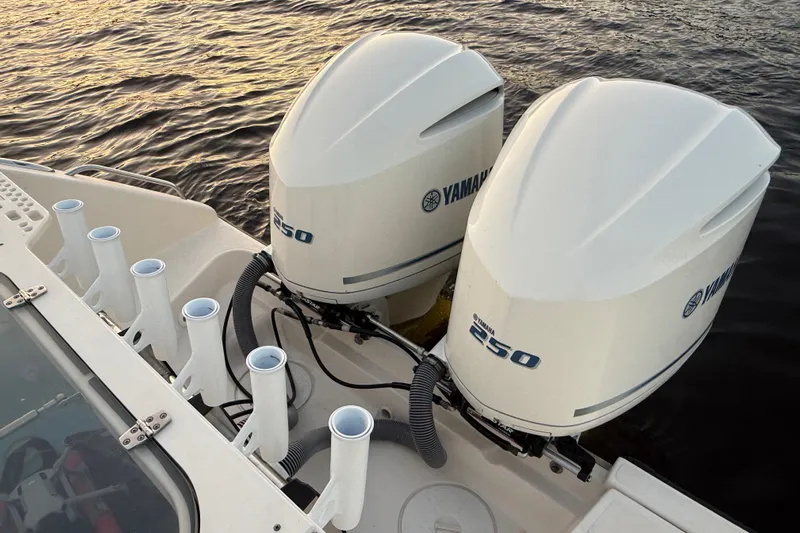  Yacht Photos Pics 2014 Pursuit S 280 Sport boat with dual Yamaha 250 outboard engines on water.