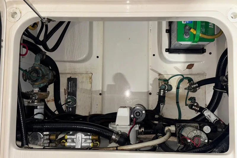  Yacht Photos Pics 2014 Pursuit S 280 Sport boat engine compartment with wiring and components.