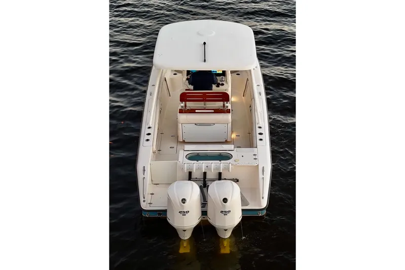  Yacht Photos Pics 2014 Pursuit S 280 Sport boat with dual engines on water.