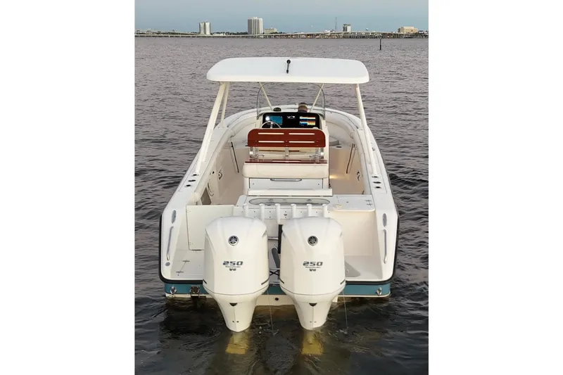  Yacht Photos Pics 2014 Pursuit S 280 Sport boat with dual 250 HP engines on water.