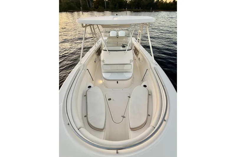  Yacht Photos Pics 2014 Pursuit S 280 Sport boat interior with seating, on calm water.