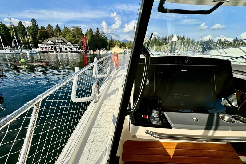 Days Ahead Yacht Photos Pics Boston Whaler 405 Conquest 2022 at marina, featuring modern cockpit and scenic waterfront view.