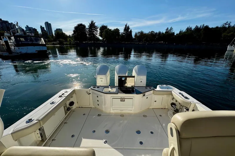 Days Ahead Yacht Photos Pics Boston Whaler 405 Conquest 2022 boat deck with scenic waterfront view.