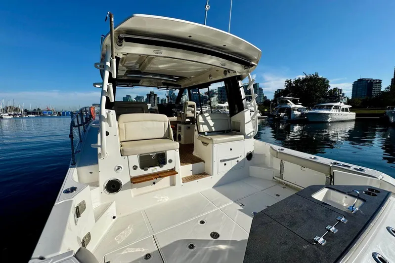 Days Ahead Yacht Photos Pics Boston Whaler 405 Conquest 2022 boat docked in a marina under clear blue skies.