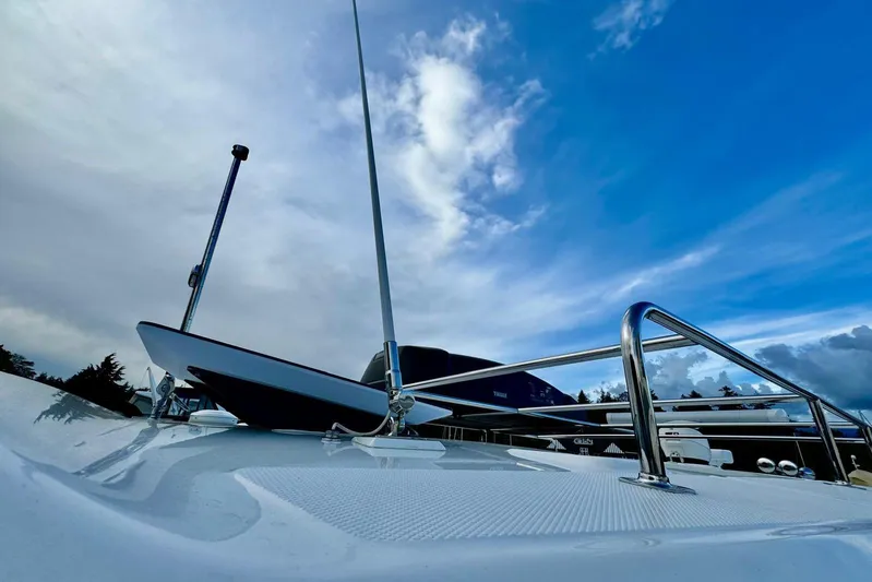 Days Ahead Yacht Photos Pics 2022 Boston Whaler 405 Conquest boat deck under a vibrant blue sky.