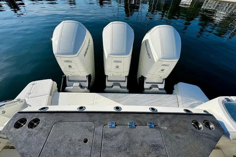 Days Ahead Yacht Photos Pics 2022 Boston Whaler 405 Conquest with triple Mercury outboard engines on calm water.