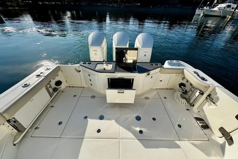 Days Ahead Yacht Photos Pics 2022 Boston Whaler 405 Conquest boat deck with dual engines and fishing amenities.