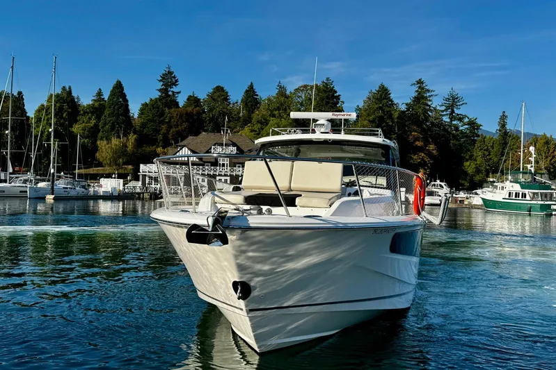 Days Ahead Yacht Photos Pics 2022 Boston Whaler 405 Conquest boat docked in a scenic marina setting.