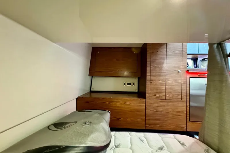 Days Ahead Yacht Photos Pics Interior cabin of 2022 Boston Whaler 405 Conquest with wood cabinetry and bed.
