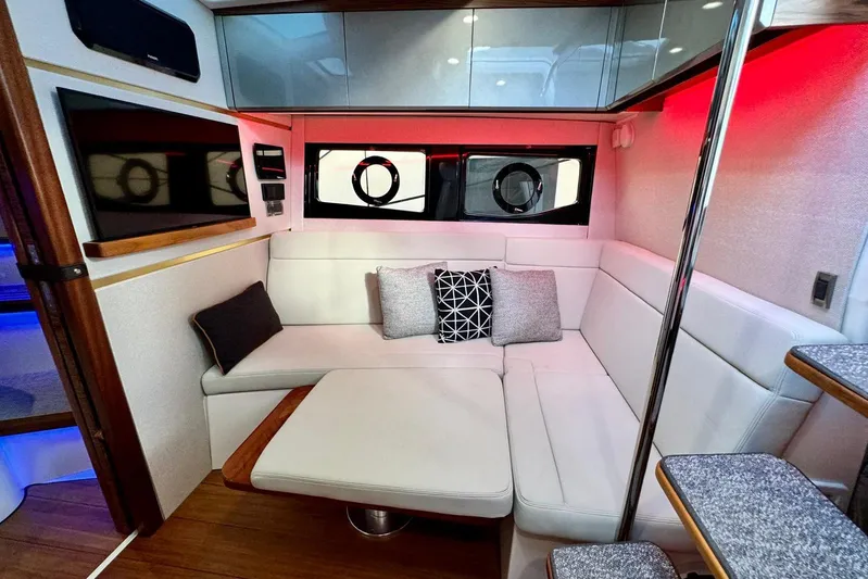 Days Ahead Yacht Photos Pics Luxurious interior of 2022 Boston Whaler 405 Conquest with modern seating and ambient lighting.