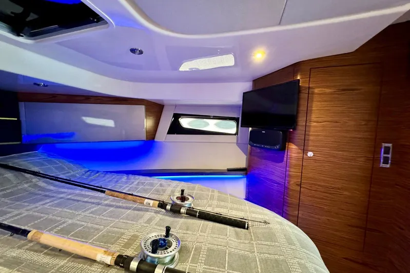 Days Ahead Yacht Photos Pics Interior of 2022 Boston Whaler 405 Conquest with fishing rods and modern amenities.