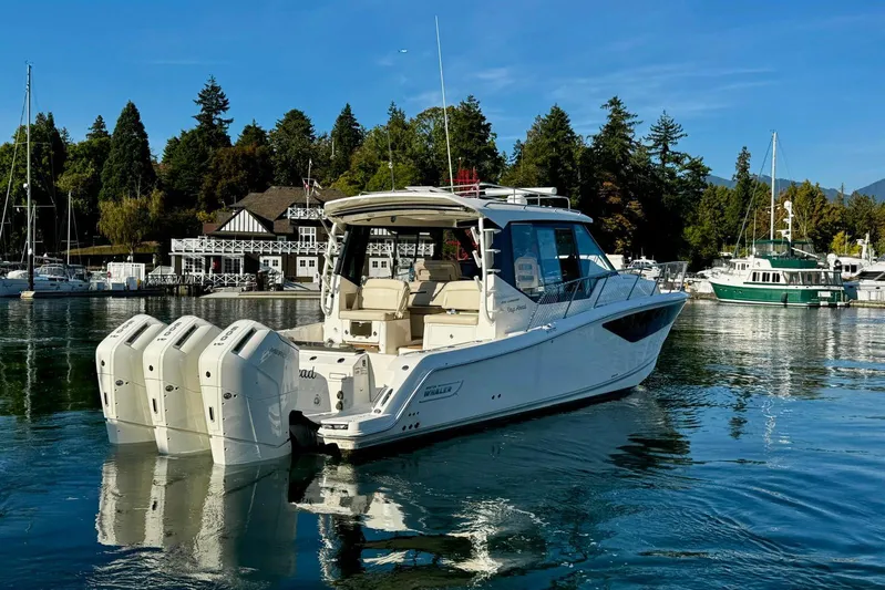 Days Ahead Yacht Photos Pics 2022 Boston Whaler 405 Conquest boat docked in scenic marina setting.