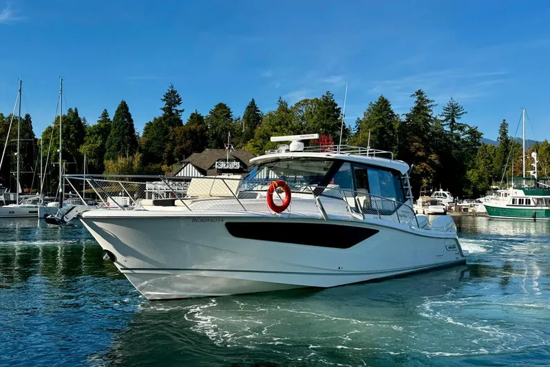 Days Ahead Yacht Photos Pics 2022 Boston Whaler 405 Conquest boat docked in a scenic marina setting.