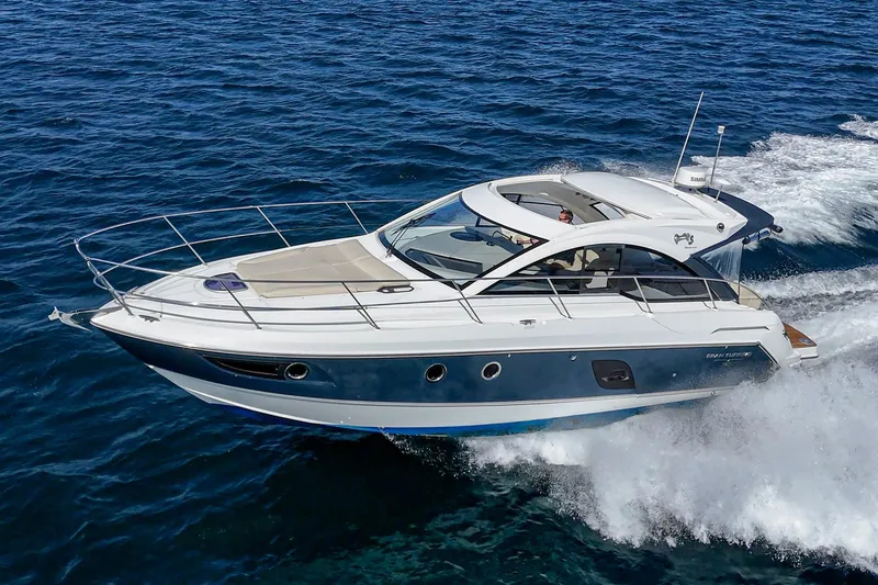  Yacht Photos Pics 2014 Beneteau Gran Turismo 38 cruising on open water, showcasing sleek design and performance.