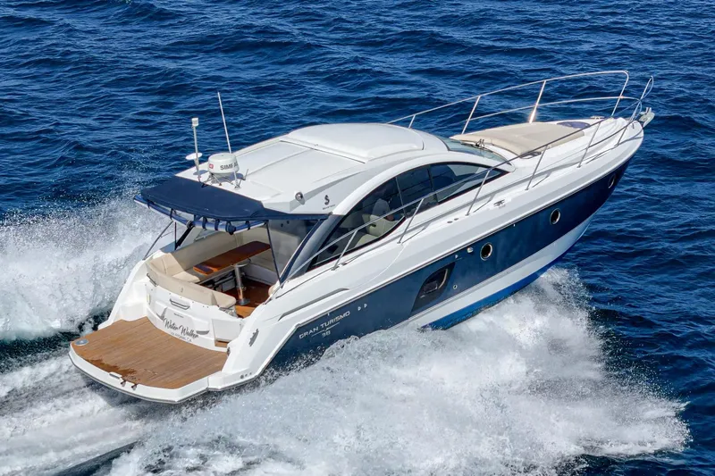  Yacht Photos Pics 2014 Beneteau Gran Turismo 38 yacht cruising on open sea.