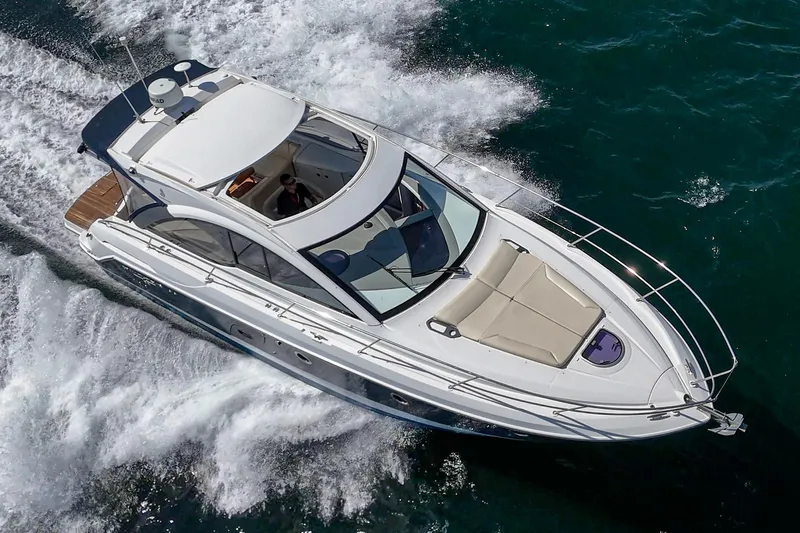  Yacht Photos Pics 2014 Beneteau Gran Turismo 38 cruising on open water, aerial view.