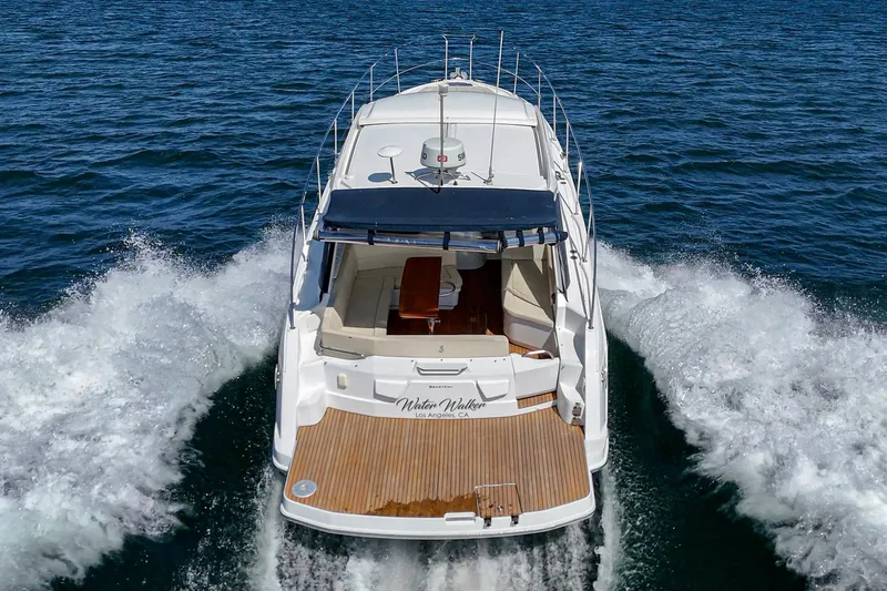  Yacht Photos Pics 2014 Beneteau Gran Turismo 38 yacht cruising on open water, rear view.