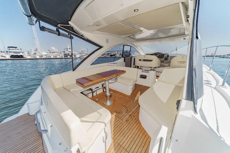  Yacht Photos Pics Luxurious 2014 Beneteau Gran Turismo 38 yacht interior with elegant seating and wooden flooring.