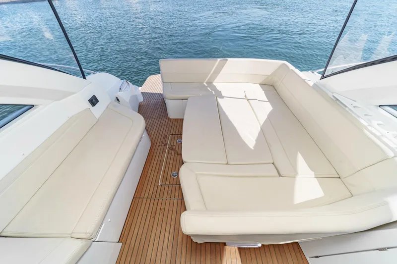 Yacht Photos Pics Luxurious seating area on 2014 Beneteau Gran Turismo 38 yacht with teak flooring.