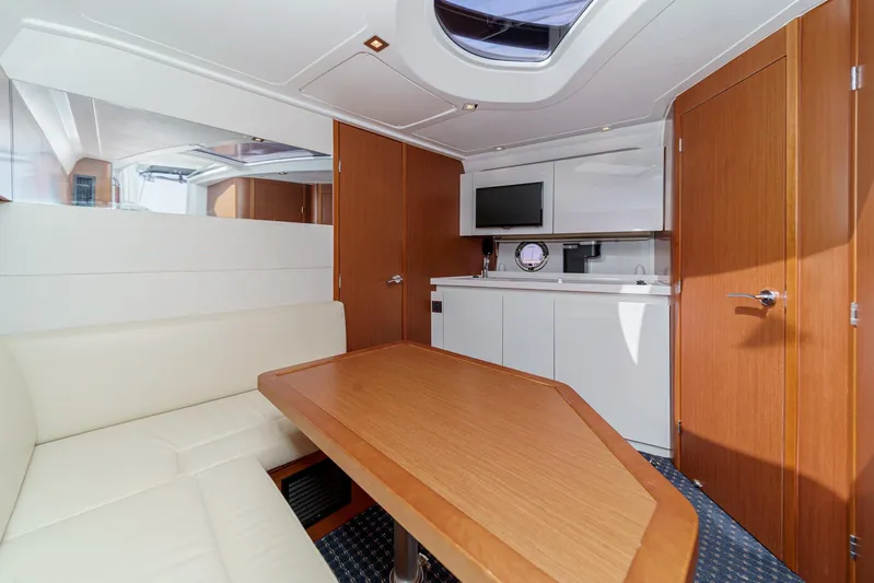  Yacht Photos Pics Interior of 2014 Beneteau Gran Turismo 38 yacht with modern kitchen and seating area.