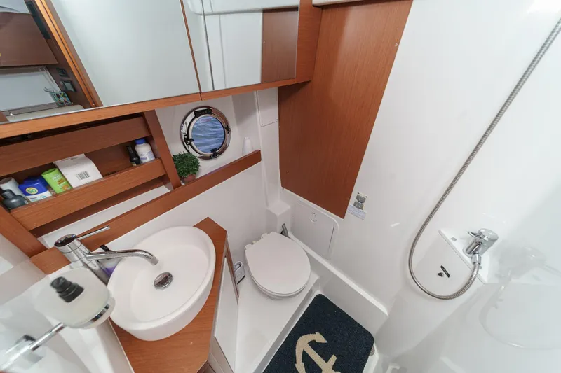  Yacht Photos Pics Bathroom interior of 2014 Beneteau Gran Turismo 38 yacht, featuring sink and shower.