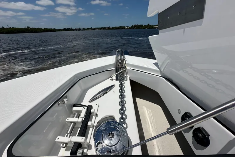  Yacht Photos Pics 2023 HCB 39 Speciale boat anchor system on calm water under blue sky.