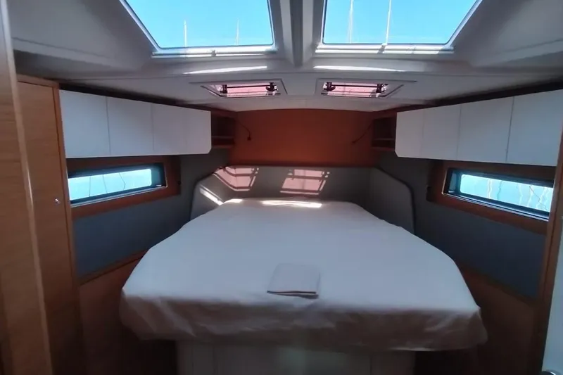  Yacht Photos Pics Luxurious cabin interior of 2024 Dufour 44 yacht with skylights and modern design.