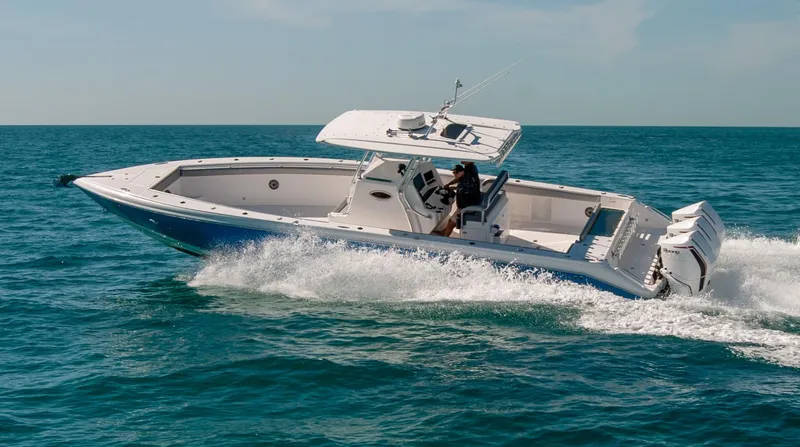  Yacht Photos Pics A sleek IMG 40 boat cruising on open water, 2021 model.