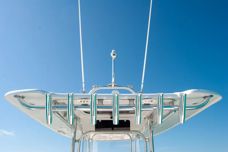  Yacht Photos Pics Modern boat tower against clear blue sky, featuring sleek design and metallic finish.