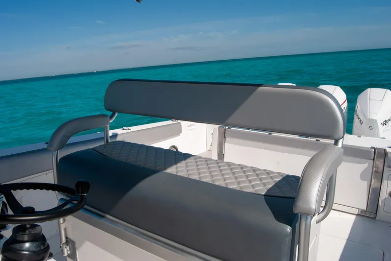  Yacht Photos Pics Boat seating with gray upholstery on turquoise water, IMG 40 model, 2021.