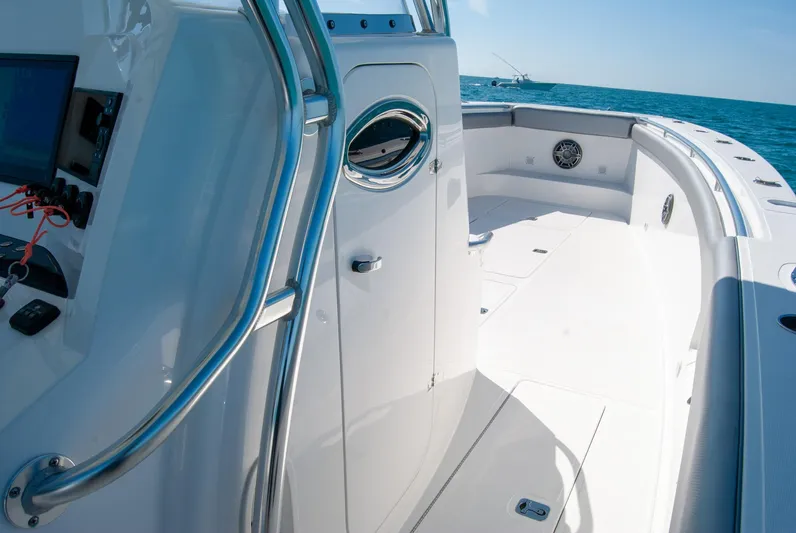  Yacht Photos Pics Modern boat deck with sleek design, stainless steel railings, and ocean view.