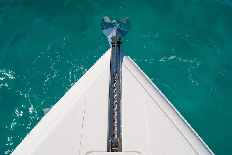  Yacht Photos Pics Bow of a boat with anchor chain over turquoise water, IMG 40 model, 2021.