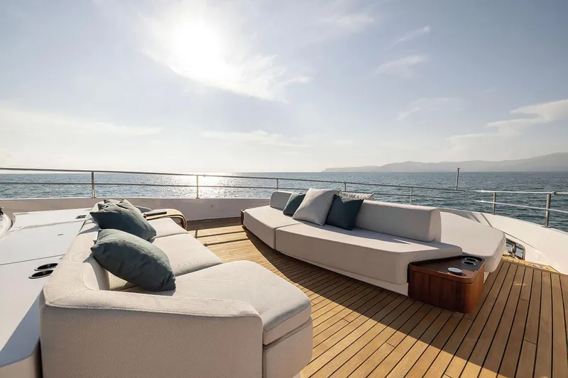  Yacht Photos Pics Luxurious deck of 2024 Azimut Magellano 30M yacht with elegant seating and ocean view.