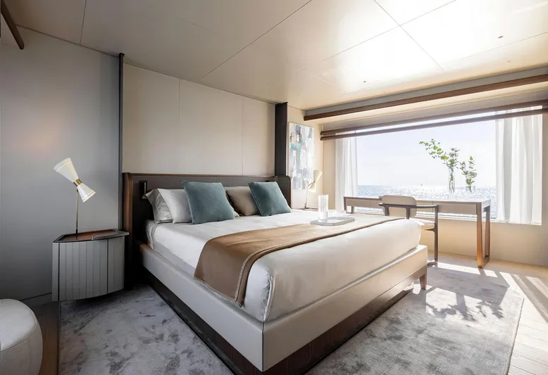  Yacht Photos Pics Luxurious bedroom interior on 2024 Azimut Magellano 30M yacht, featuring elegant decor and large window views.